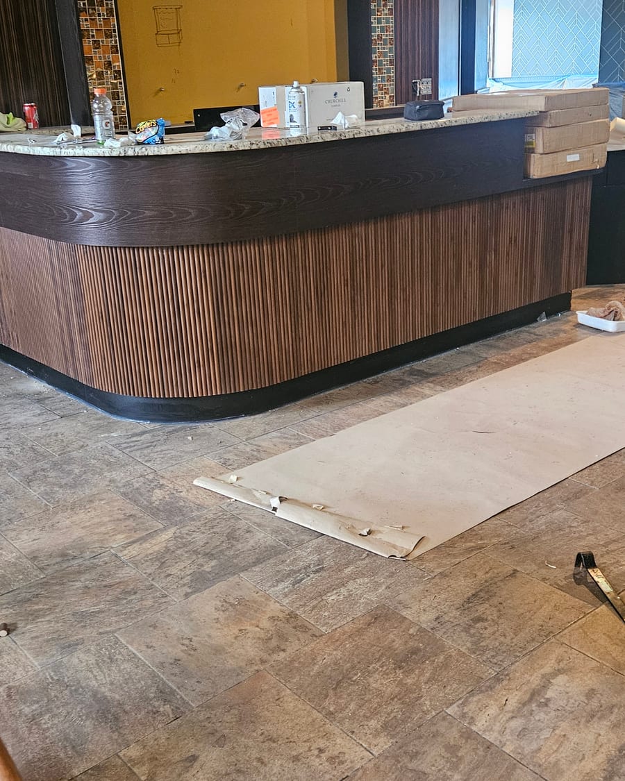 The curved wooden bar being built